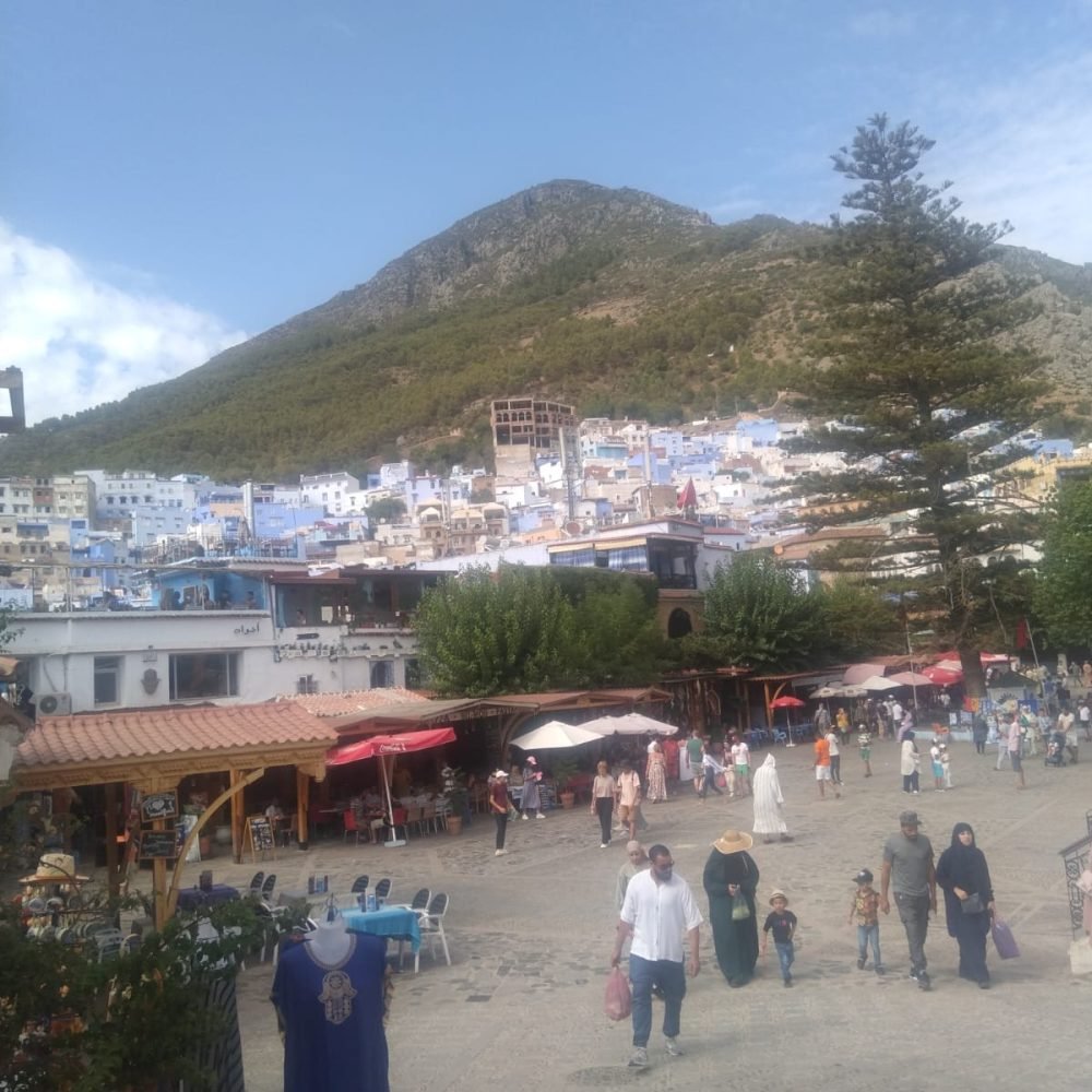 A group of people at the main square in chefchawen